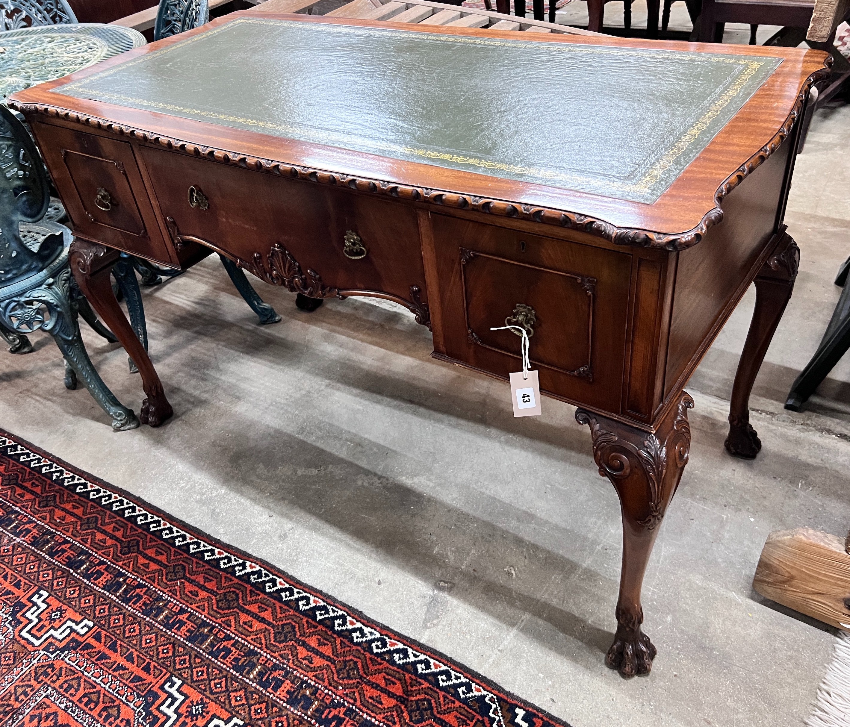 A reproduction George III style mahogany kneehole writing table, width 120cm, depth 58cm, height 76cm *Please note the sale commences at 9am.